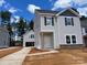 Charming two-story home with a detached garage and modern siding on a spacious lot at 4025 Grommet Ct, Matthews, NC 28105