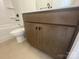 Bathroom vanity with modern hardware, adjacent to a toilet and a partially visible shower/tub combination at 4025 Grommet Ct, Matthews, NC 28105