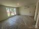 Well-lit bedroom with large windows offering neighborhood views at 4025 Grommet Ct, Matthews, NC 28105
