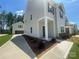 Exterior view of home showcasing attached garage and well-manicured landscaping at 4025 Grommet Ct, Matthews, NC 28105