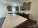 Modern kitchen featuring stainless steel appliances, white countertops and a large island at 4025 Grommet Ct, Matthews, NC 28105