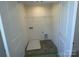 Convenient laundry room setup with hookups and shelving, ready for appliances at 4025 Grommet Ct, Matthews, NC 28105