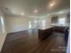 Open concept living space with kitchen featuring island, and lots of natural light at 4025 Grommet Ct, Matthews, NC 28105