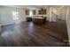 Spacious open floor plan with a modern kitchen, stainless appliances and island with a living area at 4025 Grommet Ct, Matthews, NC 28105