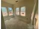Bright bedroom with large windows offering natural light and a view of the outdoors at 4029 Grommet Ct, Matthews, NC 28105