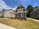 Stunning two-story home with a covered porch and attractive landscaping that provides a great curb appeal at 4029 Grommet Ct, Matthews, NC 28105