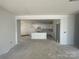 Spacious living space showcasing an open layout with an adjacent kitchen and bright, airy feel at 4029 Grommet Ct, Matthews, NC 28105