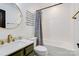 Well-lit bathroom featuring modern fixtures, a shower-tub combo, and neutral color palette at 4038 Zilker Park Dr, Charlotte, NC 28217
