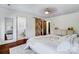 Spacious bedroom with hardwood floors, a stylish closet door, and a view into the bathroom at 4038 Zilker Park Dr, Charlotte, NC 28217