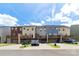 Rear view of townhomes featuring private decks and attached garages for convenience at 4038 Zilker Park Dr, Charlotte, NC 28217