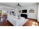 Spacious living room with stylish decor, a large tv, and an open floor plan leading to the kitchen at 4038 Zilker Park Dr, Charlotte, NC 28217