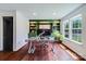 Bright home office with custom green built-ins, sleek desk, and natural light from a large window at 4038 Zilker Park Dr, Charlotte, NC 28217