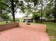 Backyard with brick patio and shed, perfect for outdoor entertaining and storage at 4315 Chandworth Rd, Charlotte, NC 28210