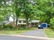 Charming two-story home with a well-manicured front yard and driveway at 4315 Chandworth Rd, Charlotte, NC 28210