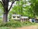 Charming two-story home with a well-manicured front yard and driveway at 4315 Chandworth Rd, Charlotte, NC 28210