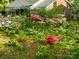 Landscaped front yard featuring azalea bushes and brickwork at 4315 Chandworth Rd, Charlotte, NC 28210