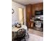 Compact kitchen with stainless steel appliances, storage, and a cozy dining area at 4315 Chandworth Rd, Charlotte, NC 28210