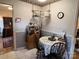 Cozy kitchen nook with floral tablecloth, convenient storage, and charming decor at 4315 Chandworth Rd, Charlotte, NC 28210