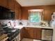 Charming kitchen with stainless steel appliances, white countertops, and hardwood cabinets at 4315 Chandworth Rd, Charlotte, NC 28210