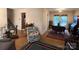 Open living area with hardwood floors, floral accents, and easy access to the kitchen at 4315 Chandworth Rd, Charlotte, NC 28210