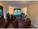 Cozy living room with a view of the outdoors, comfortable seating, and classic decor at 4315 Chandworth Rd, Charlotte, NC 28210