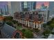 Picturesque aerial view of building complex nestled amidst cityscape, blending modern architecture with natural beauty at 435 S Tryon St # 601, Charlotte, NC 28202