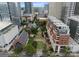 Breathtaking aerial shot highlighting the building's location, surrounded by lush greenery and cityscapes at 435 S Tryon St # 601, Charlotte, NC 28202