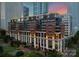 Stunning building exterior at twilight, showcasing elegant architectural design and beautifully landscaped grounds at 435 S Tryon St # 601, Charlotte, NC 28202