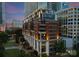Striking building exterior illuminated at dusk, featuring modern design and beautifully landscaped surroundings at 435 S Tryon St # 601, Charlotte, NC 28202