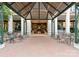 Elegant entrance featuring brick pavers, architectural overhang, and seating area at 435 S Tryon St # 601, Charlotte, NC 28202