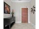 Welcoming hallway featuring neutral walls, artwork, and a decorative light fixture at 435 S Tryon St # 601, Charlotte, NC 28202