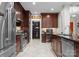 Elegant kitchen featuring stainless steel appliances, pantry, and a built-in desk area at 435 S Tryon St # 601, Charlotte, NC 28202