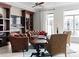 Cozy living room with leather furniture, fireplace, built-in shelves, and natural light at 435 S Tryon St # 601, Charlotte, NC 28202