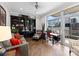 Comfortable living room with large windows, hardwood floors, and a built-in bookcase at 435 S Tryon St # 601, Charlotte, NC 28202