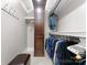 Organized walk-in closet featuring custom shelving, drawers, and hanging rods at 435 S Tryon St # 601, Charlotte, NC 28202
