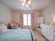 Cozy bedroom features a bed, window, chair, and dresser at 4618 Dallas High Shoals Hwy, Dallas, NC 28034