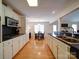 Bright, galley-style kitchen with sleek countertops and modern appliances at 4618 Dallas High Shoals Hwy, Dallas, NC 28034