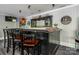 Close-up of the stylish basement bar with seating, storage, and attractive lighting at 46827 Tall Whit Rd, New London, NC 28127