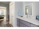 Bright bathroom featuring modern vanity, quartz countertop, and natural light perfect for a serene retreat at 46827 Tall Whit Rd, New London, NC 28127