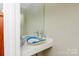 Unique powder room featuring decorative sink basin, designer faucet, and ample counter space at 46827 Tall Whit Rd, New London, NC 28127