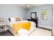 Cozy bedroom with neutral colors, fluffy rug, and bright window creating a serene atmosphere at 46827 Tall Whit Rd, New London, NC 28127