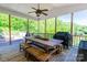 Spacious covered deck perfect for outdoor dining with a large table and grill at 46827 Tall Whit Rd, New London, NC 28127