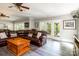 Spacious living room features a leather sectional sofa, an entertainment center and a nearby dining table at 46827 Tall Whit Rd, New London, NC 28127