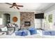 Cozy living room featuring a stone fireplace, plush seating, and French doors to the outside at 46827 Tall Whit Rd, New London, NC 28127