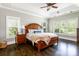 Spacious main bedroom with tray ceilings, hardwood floors, and plenty of natural light from large windows at 46827 Tall Whit Rd, New London, NC 28127