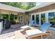 Beautiful backyard deck with outdoor seating, lounge chairs, and views of the surrounding landscape at 46827 Tall Whit Rd, New London, NC 28127