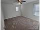 Neutral bedroom with carpet, ceiling fan and two windows at 5031 Burnwald Ct, Fort Mill, SC 29715