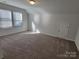 Bright bonus room with carpet, a storage closet and two windows at 5031 Burnwald Ct, Fort Mill, SC 29715