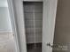 Walk-in closet with carpet and white shelving at 5031 Burnwald Ct, Fort Mill, SC 29715