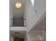 Bright, two-story foyer featuring modern light fixture and upper level railing at 5031 Burnwald Ct, Fort Mill, SC 29715
